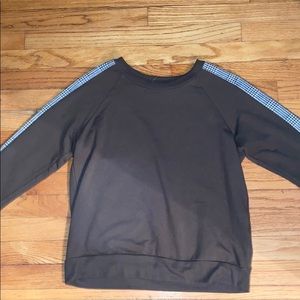 army green sweatshirt with plaid accent on arms